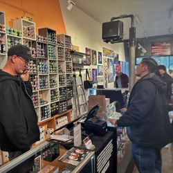 Overspray Art Supply & Gallery - One of the owners helping a customer