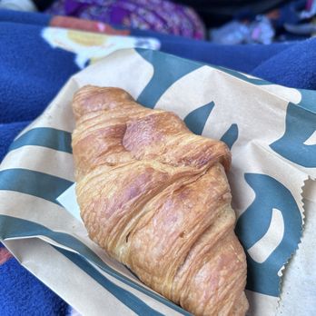 Starbucks - a croissant in a paper bag - Coffee & Tea Near Me - Gainesville, Florida Starbucks - a croissant in a paper bag - Coffee & Tea Near Me - Gainesville, Florida