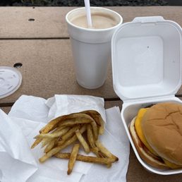 At my picnic table outside eating a double cheeseburger, cold small fries, and milkshake At my picnic table outside eating a double cheeseburger, cold small fries, and milkshake