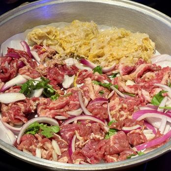 The Station - Three types of beef and sauerkraut in the aluminum pan - Barbeque Near Me - Flushing, New York