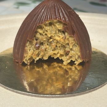 Cozy Drop - Indulging in the viral Dubai chocolate craze with this stunning, dome-shaped "chocolate drop." A loud crunch with every bite. - Breakfast & Brunch Near Me - Parkland, Florida Cozy Drop - Indulging in the viral Dubai chocolate craze with this stunning, dome-shaped "chocolate drop." A loud crunch with every bite. - Breakfast & Brunch Near Me - Parkland, Florida