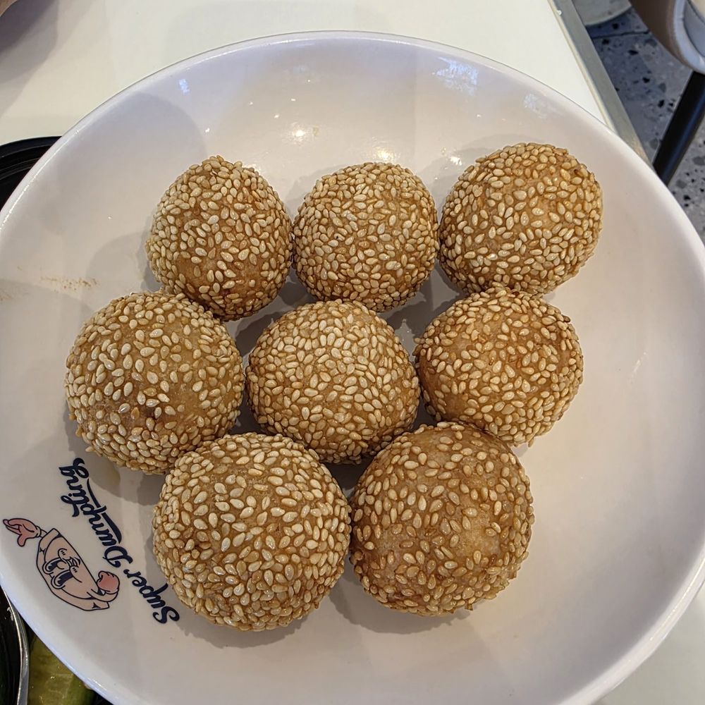 Super Dumpling - Sesame balls - comes out super hot!! Make sure you give it a min before you bite into it! - Noodles Near Me - Orange, California Super Dumpling - Sesame balls - comes out super hot!! Make sure you give it a min before you bite into it! - Noodles Near Me - Orange, California