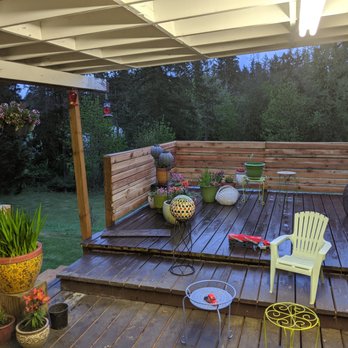 The Ginger Fixer - a deck with chairs and a table - General Contractors Near Me - Puyallup, Washington The Ginger Fixer - a deck with chairs and a table - General Contractors Near Me - Puyallup, Washington