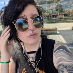Facial piercings in natural lighting by Candy
