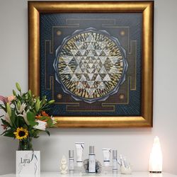 The Skincare Therapist, LLC - Sri Yantra by artist Aspen Moon hanging in treatment room.