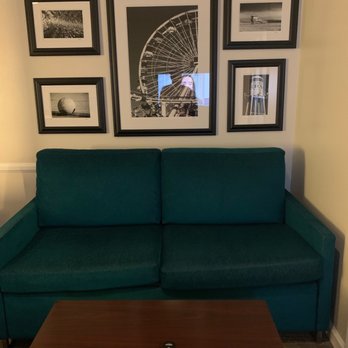 Peacock Suites - Living room with tv, as well as a small kitchenette and table with 4 chairs (not pictured) - Hotels Near Me - Anaheim, California Peacock Suites - Living room with tv, as well as a small kitchenette and table with 4 chairs (not pictured) - Hotels Near Me - Anaheim, California