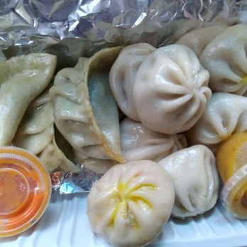 Yeti Kitchen - a plate of dumplings and sauce - Himalayan/Nepalese Near Me - Toronto, Ontario