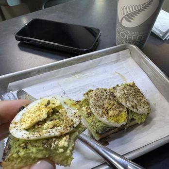 Chocolate Fish Coffee Roasters - Avo toast with egg, seasonings and oil - Coffee & Tea Near Me - Sacramento, California Chocolate Fish Coffee Roasters - Avo toast with egg, seasonings and oil - Coffee & Tea Near Me - Sacramento, California