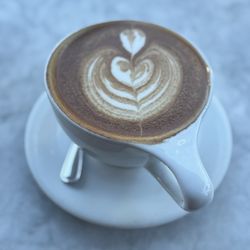 Large (16 oz) hot cafe latte w/cinnamon & made w/coconut & oat milk...beautifully & deliciously made today