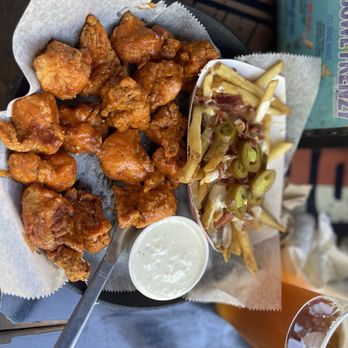 Hurricane Grill & Wings - Boneless hot wings with jalapeños bacon fries - American Near Me - Jacksonville, Florida