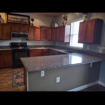 Upscale Turnover Solutions - a kitchen with granite counter tops - General Contractors Near Me Upscale Turnover Solutions - a kitchen with granite counter tops - General Contractors Near Me