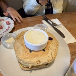 Blueberry pancakes with whipped cream