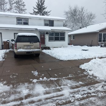 Living Water Lawn Care - a car parked in front of a house - Snow Removal Near Me Living Water Lawn Care - a car parked in front of a house - Snow Removal Near Me
