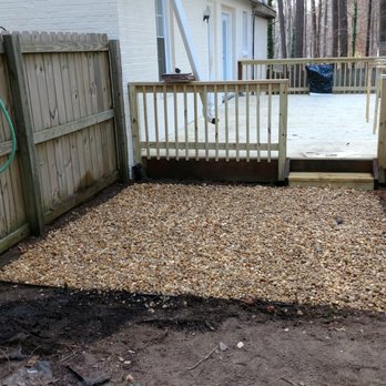 Grand Design - a backyard area with a fence and gravel - Landscaping Near Me - Raleigh, North Carolina Grand Design - a backyard area with a fence and gravel - Landscaping Near Me - Raleigh, North Carolina