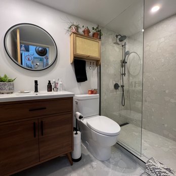 Blue Ocean Construction - a bathroom with a toilet and shower - General Contractors Near Me - Burnaby, British Columbia