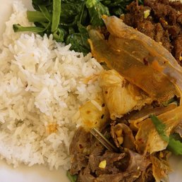 Snow 89. Sauteed Pea Shoot with Garlic / 10. Beef and Trip in Chili Oil/ C22. Cumin Style Lamb / - A dish featuring steamed white rice accompanied by sautéed leafy greens, beef in chili oil, and pickled vegetables, typical of Chinese cuisine.