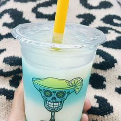 Mr. Froze Margarita - A "half-cup" of Mr. Snoop (like a Blue Hawaiian/Ocean water ) and Piña Colada with a shot of tequila, swirled perfectly together by Jess!