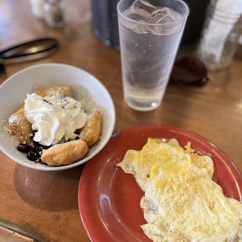 Ruby Slipper Central Business District - Blueberry lemon curd beignet and two over hard eggs - Breakfast & Brunch Near Me - New Orleans, Louisiana
