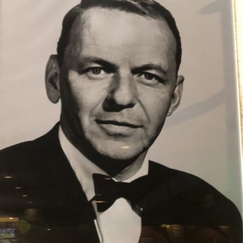 Buca di Beppo Italian Restaurant - Portrait on the wall of a famous Italian American celebrity Frank Sinatra - Italian Near Me - San Diego, California Buca di Beppo Italian Restaurant - Portrait on the wall of a famous Italian American celebrity Frank Sinatra - Italian Near Me - San Diego, California