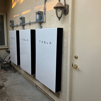 Tesla Energy - Three Powerwalls behind garage - Solar Installation Near Me Tesla Energy - Three Powerwalls behind garage - Solar Installation Near Me