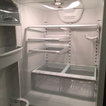Santos Cleaning Services - The tenant made the refrigerator very disgusting.  Santos made the refrigerator looks white and clean like new again. - Home Cleaning Near Me
