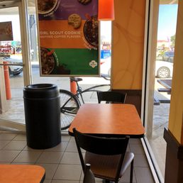 a table and chairs in a restaurant