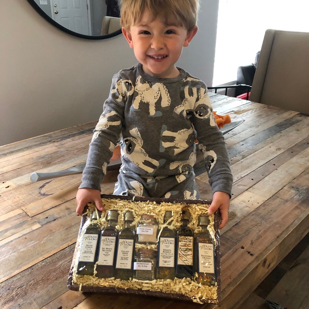 Olivas de Oro - Mother's Day basket being shown off by my grandson! - Olive Oil Near Me - Paso Robles, California Olivas de Oro - Mother's Day basket being shown off by my grandson! - Olive Oil Near Me - Paso Robles, California