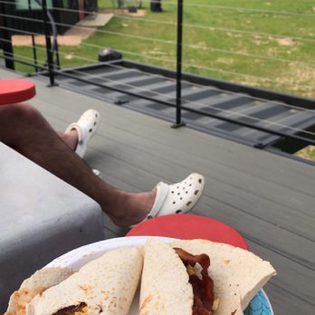 Happy Goat Retreat - We made breakfast tacos in our little kitchen & sat on the rooftop deck - Vacation Rentals Near Me - Willis, Texas