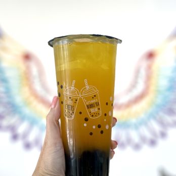 Pearl Boba Tea and Snacks - a hand holding a cup - Bubble Tea Near Me - Davie, Florida Pearl Boba Tea and Snacks - a hand holding a cup - Bubble Tea Near Me - Davie, Florida