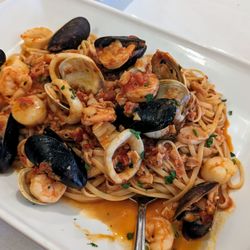 Tirami Su Italian Restaurant of Northville - I've had the linguini pescatore before, clams, mussels, calamari, shrimp, and scallops in a slightly sweet tomato sauce. So so so good.