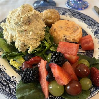 Pemberley's at The Jones House - Chicken salad platter with fresh fruit,  a small orange gelatin,  and a mini lemon poppyseed muffin. - Bed & Breakfast Near Me - Nacogdoches, Texas