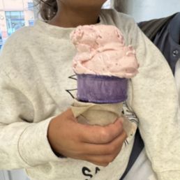 Strawberry ice cream in a purple cone Strawberry ice cream in a purple cone