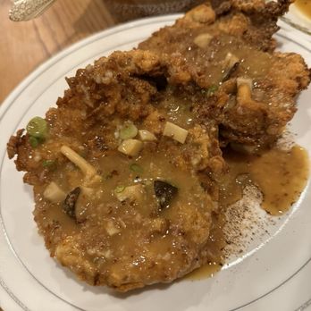 Burdell - Oakland Restaurant Week 2025 Special - Double Smothered Pork Chop with Bacon and Mushroom Gravy - Soul Food Near Me - Oakland, California Burdell - Oakland Restaurant Week 2025 Special - Double Smothered Pork Chop with Bacon and Mushroom Gravy - Soul Food Near Me - Oakland, California