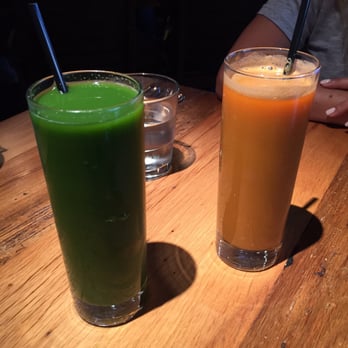 Beatrix - Power greens juice (left) and carrot, apple, and ginger snap juice (right) - New American Near Me - Chicago, Illinois Beatrix - Power greens juice (left) and carrot, apple, and ginger snap juice (right) - New American Near Me - Chicago, Illinois