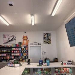 Dispensary counter with various products and art