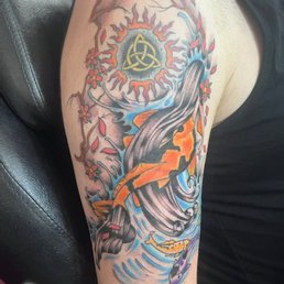Sun tattoo with celtic knot was the orignal redone tattoo. Flex designed the bordering mermaid and cherry blossom tattoo. Sun tattoo with celtic knot was the orignal redone tattoo. Flex designed the bordering mermaid and cherry blossom tattoo.