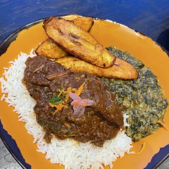 Baobab Fare - Nyumbani: loved this coconut rice with beef in a tomato sauce. Spinach was a delicious and a bonus with plantains. - Coffee & Tea Near Me - Detroit, Michigan