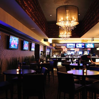 The Bar at IPIC Theaters - a bar with a chandelier - Sports Bars Near Me - Fairview, Texas The Bar at IPIC Theaters - a bar with a chandelier - Sports Bars Near Me - Fairview, Texas