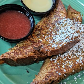 The Flying Biscuit Cafe - French toast with raspberry sauce and honey creme anglaise. - Breakfast & Brunch Near Me - Kennesaw, Georgia The Flying Biscuit Cafe - French toast with raspberry sauce and honey creme anglaise. - Breakfast & Brunch Near Me - Kennesaw, Georgia