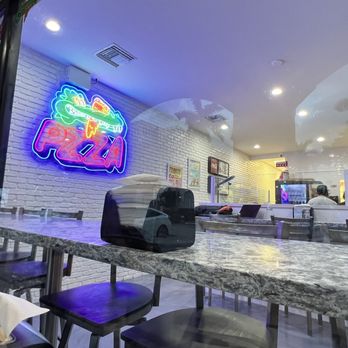 PZZA& : Boca Raton - Inside of establishment from window - Pizza Near Me - Boca Raton, Florida PZZA& : Boca Raton - Inside of establishment from window - Pizza Near Me - Boca Raton, Florida
