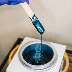Bare Culture - We use stripless hard wax. Hard wax wraps itself around the hair and doesn't adhere to the skin. making the wax experience less painful.