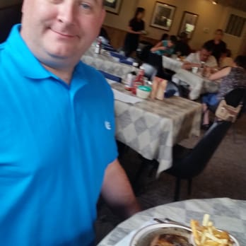 Rene's Dining Room - a man sitting at a table with a plate of food - American Near Me - Crivitz, Wisconsin