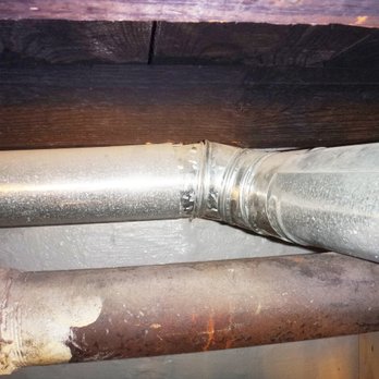 REM Home Inspections - Combustion flue for water heater too close to wood floor joist, fire hazard, inspection 6/18/19 - Home Inspectors Near Me - Springfield, Virginia