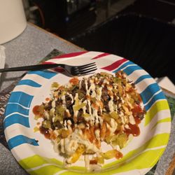 Bucking Good BBQ - Twice baked, 1lb potato loaded with choice of brisket or pulled pork.