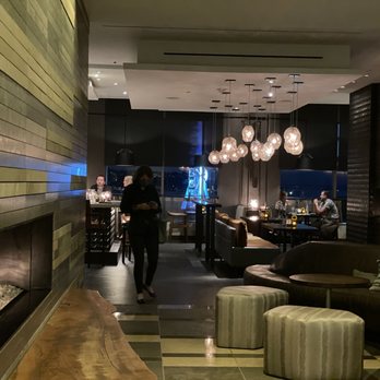 Four Seasons Hotel Seattle - In the lobby, you see the fireplace and Goldfinch Tavern. - Hotels Near Me - Seattle, Washington Four Seasons Hotel Seattle - In the lobby, you see the fireplace and Goldfinch Tavern. - Hotels Near Me - Seattle, Washington