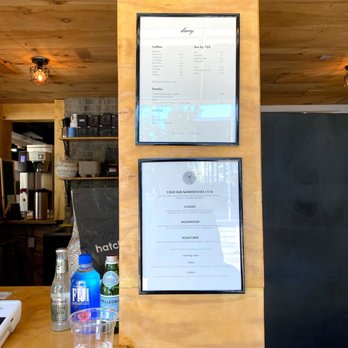 Bevy - a menu on a wall in a restaurant - Coffee & Tea Near Me - Toronto, Ontario