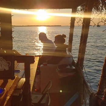 Tiki Joe's Cruise - Sunset over the bar on the Beeracuda. - Boat Charters Near Me Tiki Joe's Cruise - Sunset over the bar on the Beeracuda. - Boat Charters Near Me