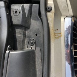 Oil stains down the front of the car.