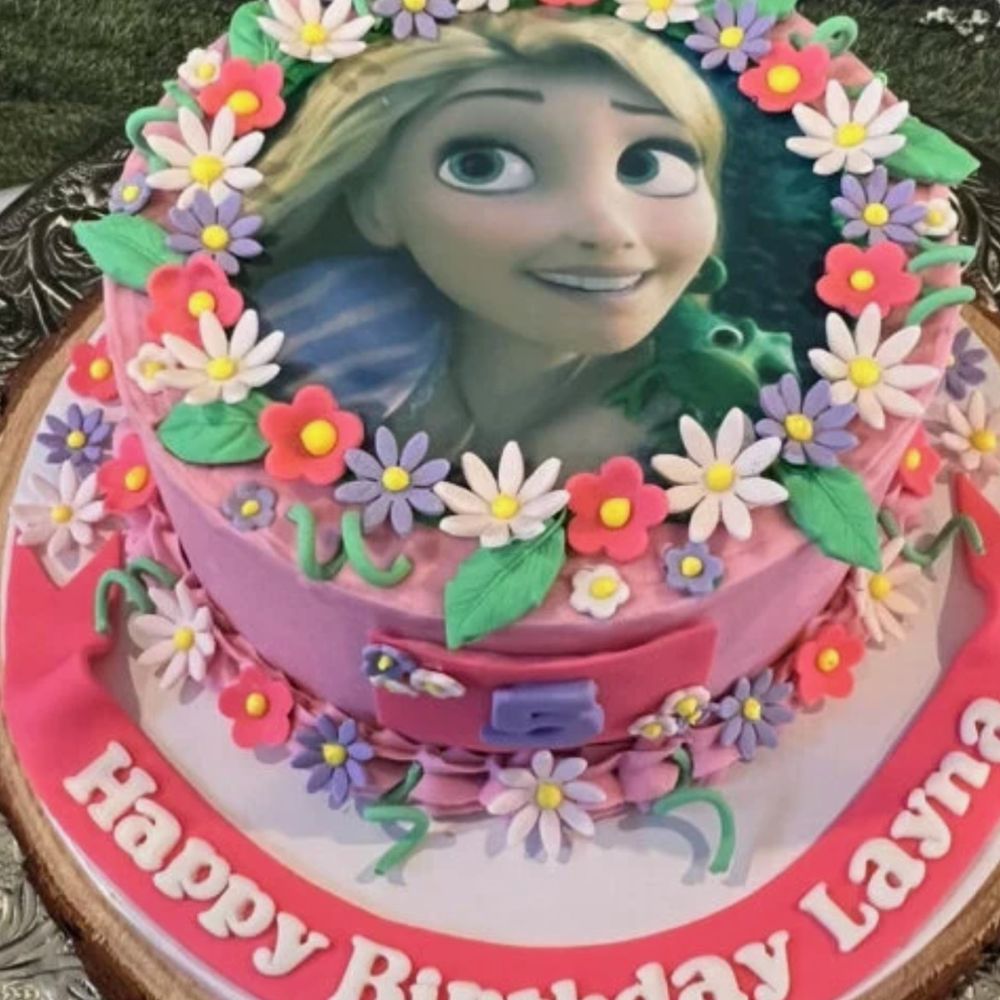 Palm Beach Bakes - This was on his website. This is a "Rapunzel" cake. Notice the flowers on the side and top as well as the 5 on the side. Mine had non - Custom Cakes Near Me - Lake Worth, Florida Palm Beach Bakes - This was on his website. This is a "Rapunzel" cake. Notice the flowers on the side and top as well as the 5 on the side. Mine had non - Custom Cakes Near Me - Lake Worth, Florida