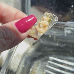 Piece of plastic cooked into my piece of salmon. Piece of plastic cooked into my piece of salmon.